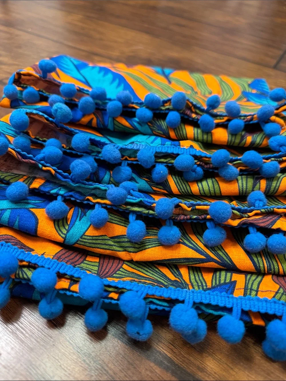 TMD Set of 4 Tropical Cloth Napkins Blue Orange Pom Pom Trim 19x19 NWOT